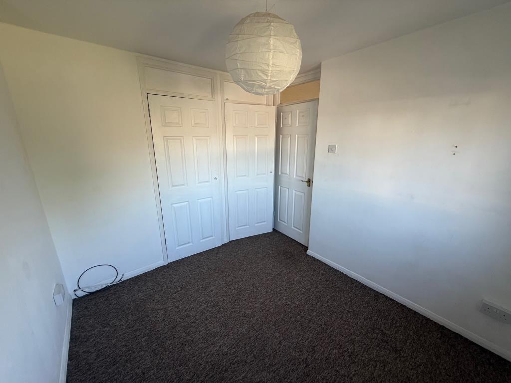 Lot: 161 - THREE-BEDROOM HOUSE WITH GARAGE - Second bedroom carpeted and painted white